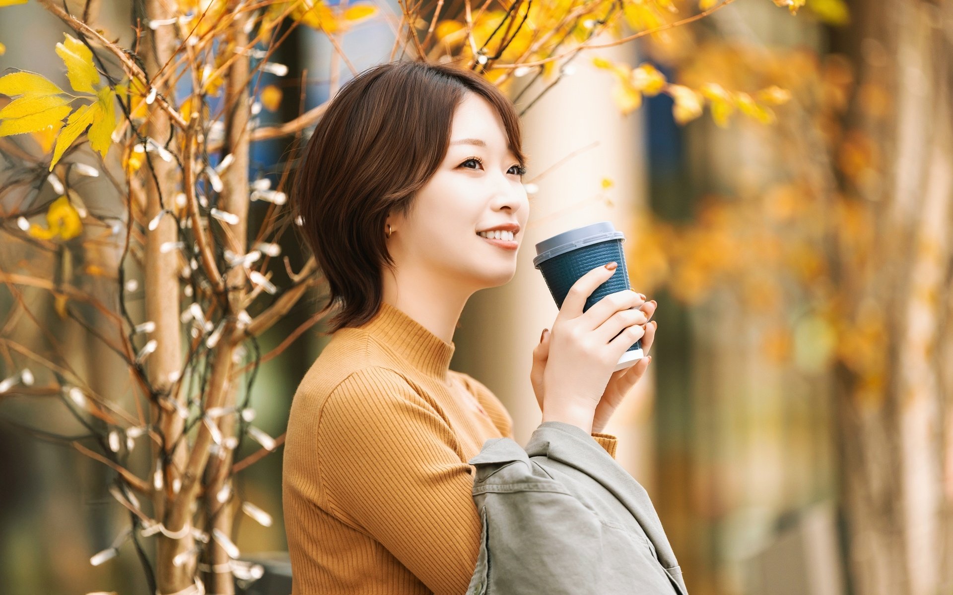 woman-drinking-coffee-autumn-cafe-converted.jpg
