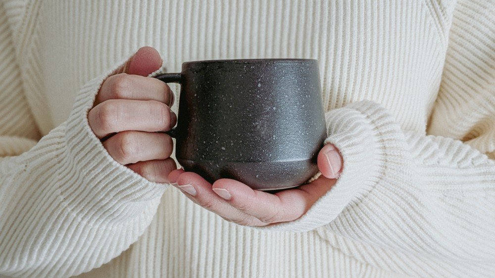 woman-holding-warm-mug-closeup_converted.jpg